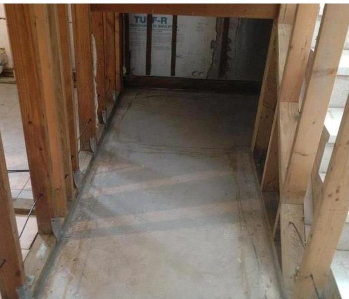 a photo of wood framing and concrete floor