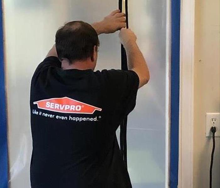 Technician learning how to use a zipper door