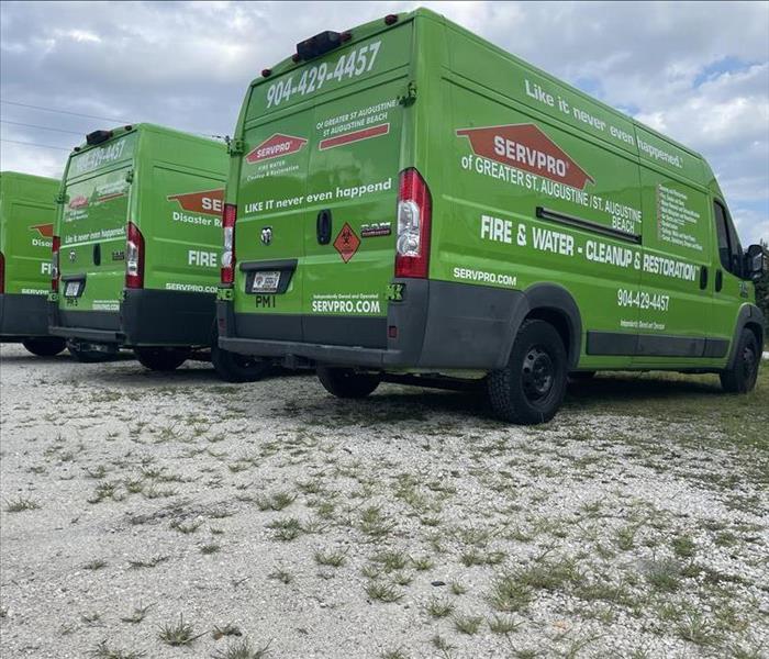 a picture of our three SERVPRO branded trucks in parking lot 